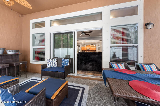 view of patio featuring outdoor lounge area and ceiling fan