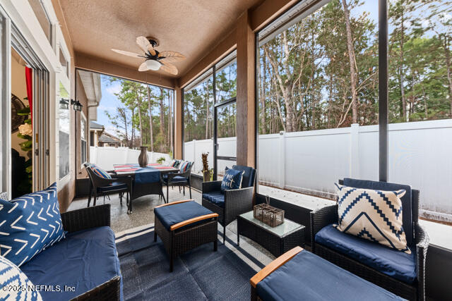 sunroom / solarium with ceiling fan