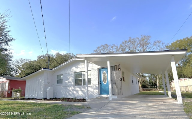 view of front of home with a carport