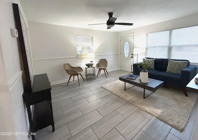 living room with plenty of natural light and ceiling fan