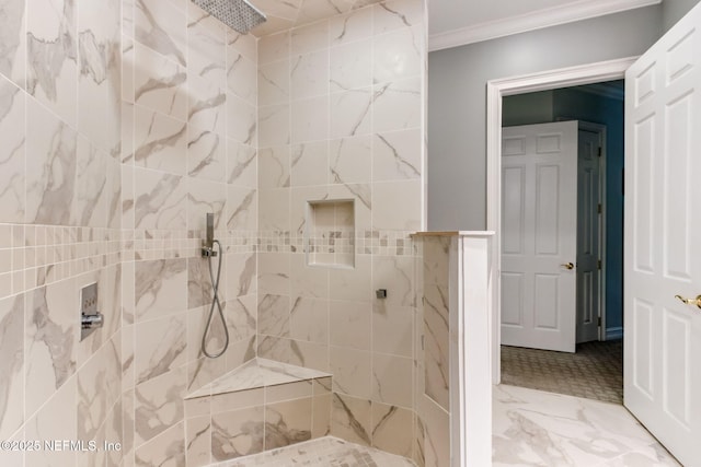 bathroom with tiled shower, marble finish floor, and crown molding