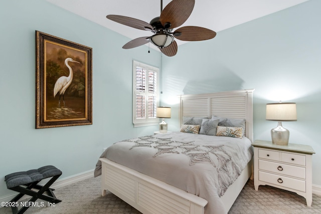 bedroom featuring baseboards, carpet floors, and ceiling fan