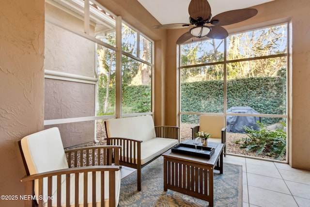 sunroom featuring a ceiling fan