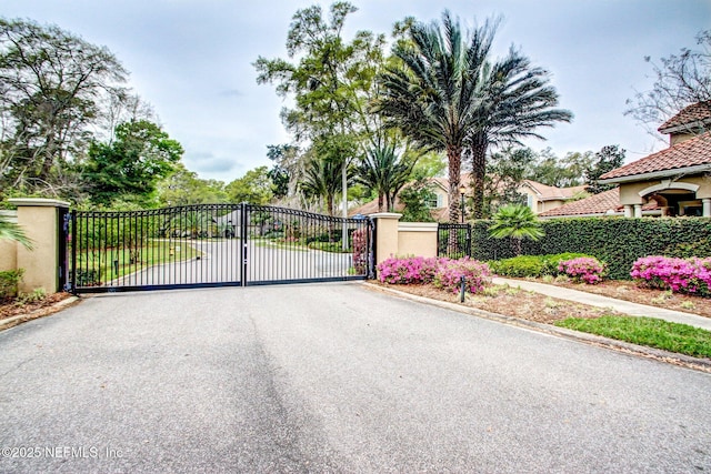 view of gate with fence