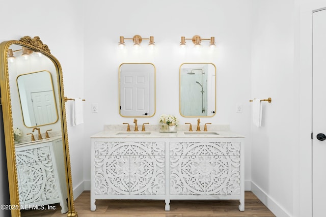 bathroom with vanity and hardwood / wood-style flooring