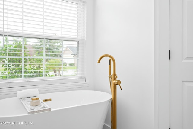 bathroom featuring a tub to relax in