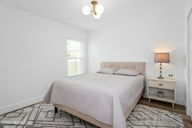 bedroom with wood-type flooring