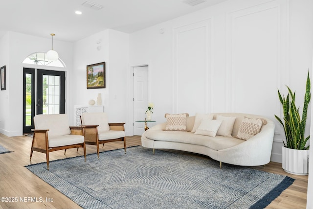 living room with light hardwood / wood-style flooring