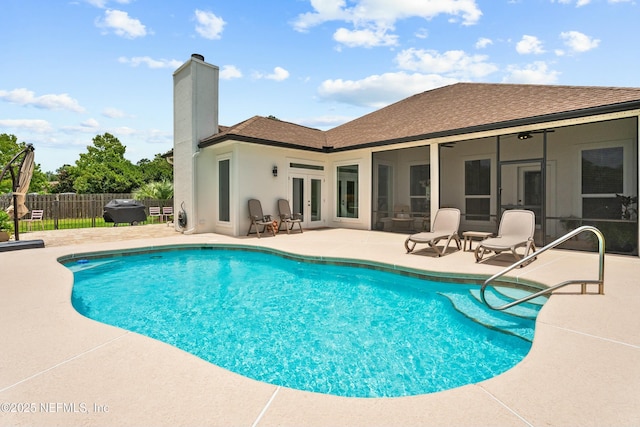 view of pool featuring french doors and a patio area