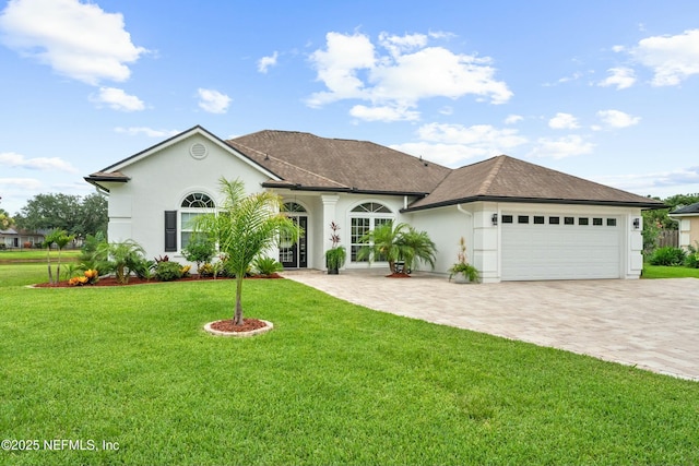 view of front facade featuring a garage and a front yard