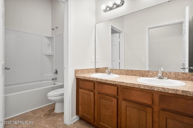 full bathroom featuring bathtub / shower combination, vanity, and toilet