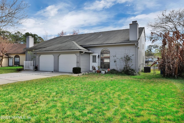 ranch-style house featuring concrete driveway, a front lawn, and a chimney