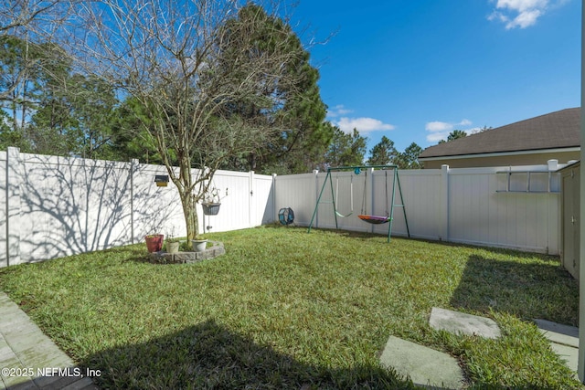 view of yard with a fenced backyard