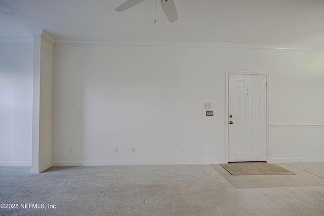 unfurnished room with light carpet, ceiling fan, and crown molding