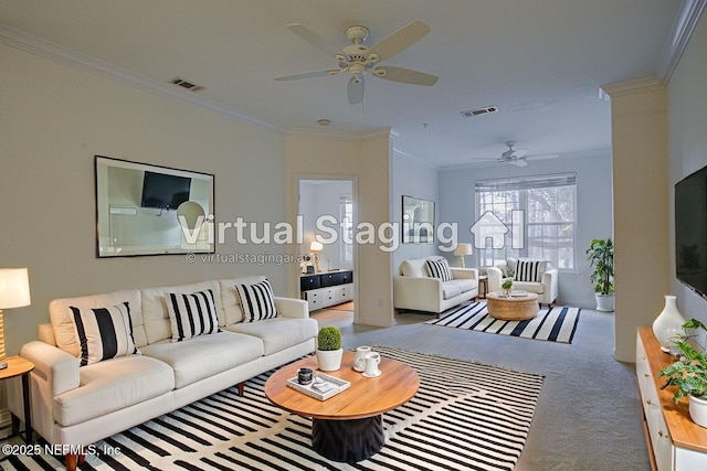 carpeted living room with crown molding and ceiling fan