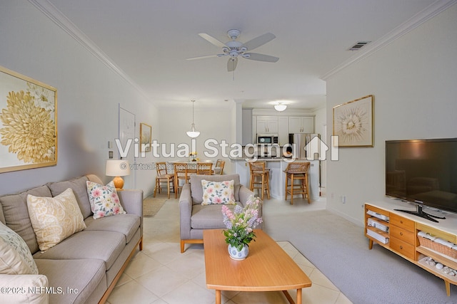 tiled living room with crown molding and ceiling fan