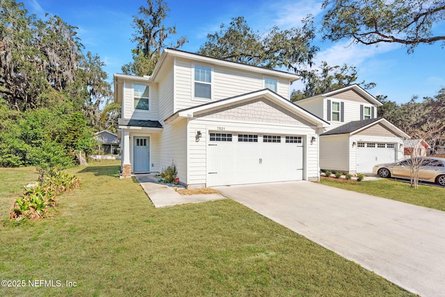 view of property featuring a garage and a front lawn