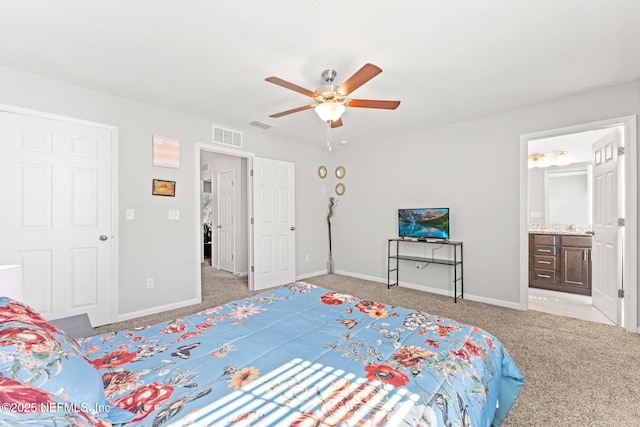 bedroom with light carpet, connected bathroom, and ceiling fan