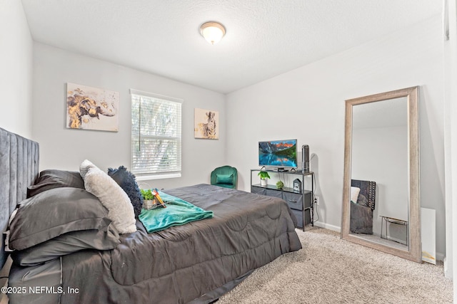 carpeted bedroom with a textured ceiling