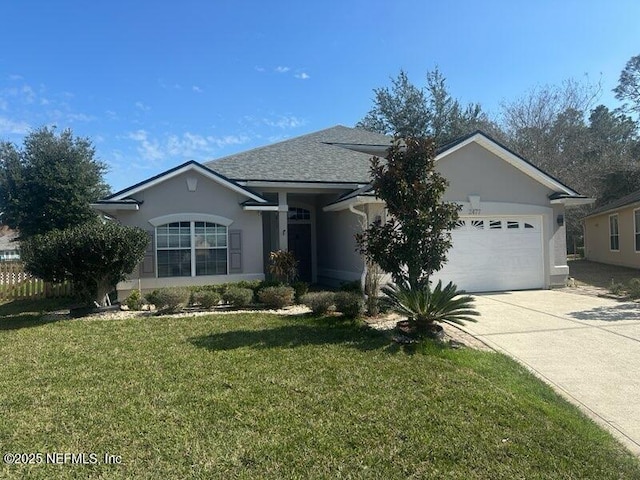 single story home featuring a garage and a front lawn