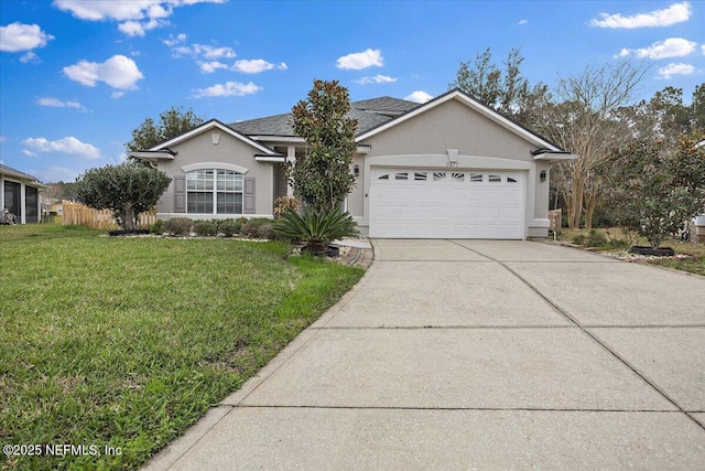 ranch-style home with a garage and a front lawn