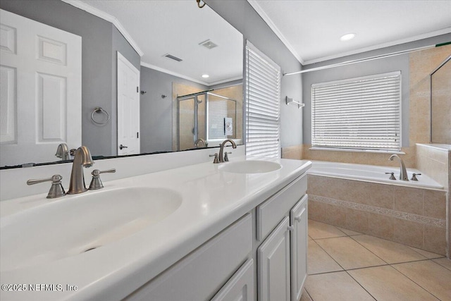 bathroom with tile patterned flooring, ornamental molding, separate shower and tub, and vanity