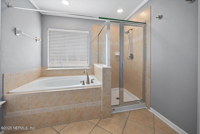 bathroom featuring tile patterned flooring and separate shower and tub