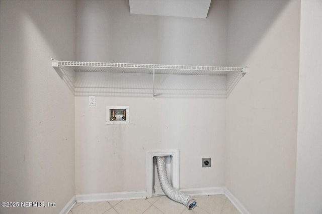 washroom featuring electric dryer hookup, washer hookup, and light tile patterned flooring