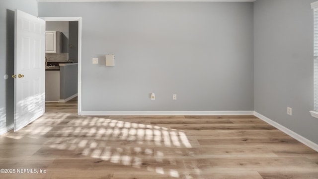 unfurnished room featuring light wood-type flooring