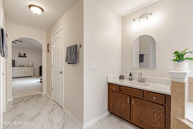 bathroom featuring vanity and a textured ceiling