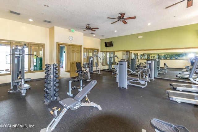 gym featuring ceiling fan and a textured ceiling