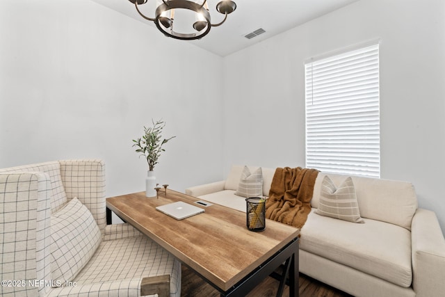 home office with an inviting chandelier