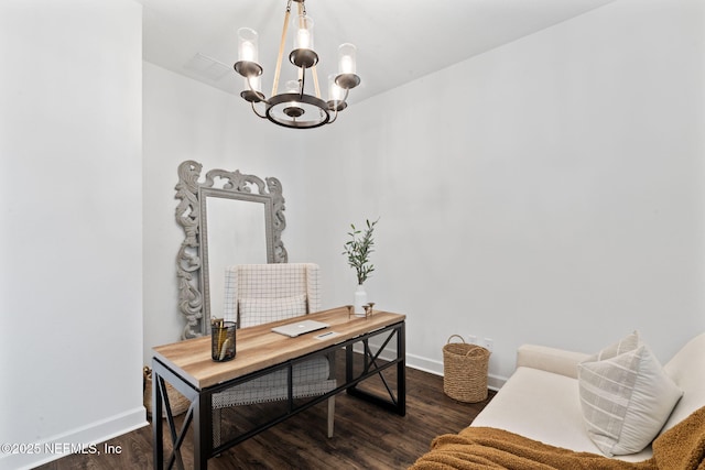 home office featuring dark hardwood / wood-style flooring and a chandelier