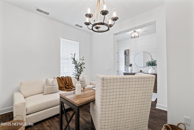 interior space featuring a notable chandelier and dark wood-type flooring