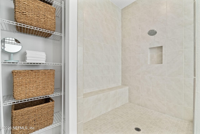 bathroom featuring tiled shower