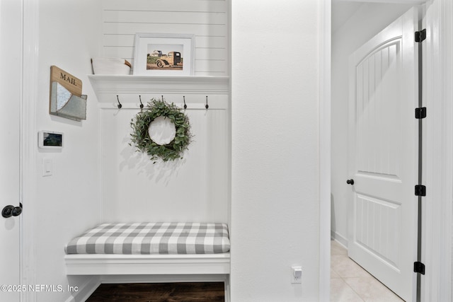 mudroom with light tile patterned floors