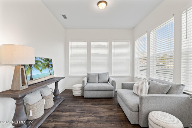 living room with dark hardwood / wood-style flooring