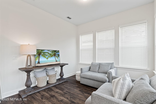 living room featuring dark wood-type flooring