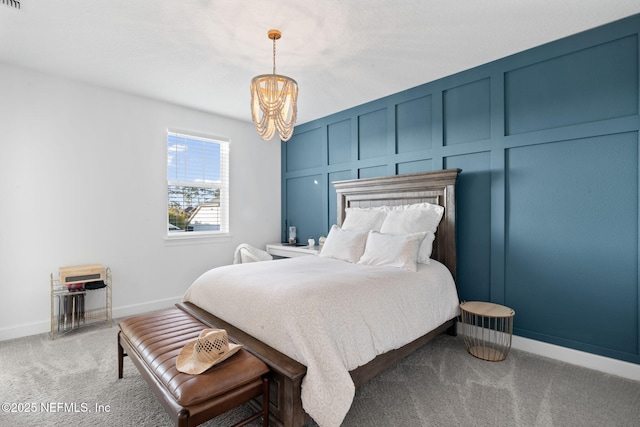 carpeted bedroom featuring a notable chandelier