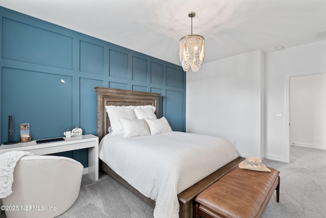 bedroom with carpet and a chandelier