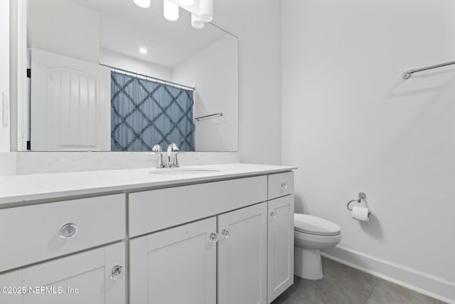 bathroom featuring vanity, a shower with shower curtain, tile patterned floors, and toilet