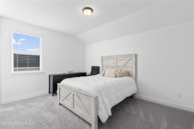 carpeted bedroom featuring vaulted ceiling