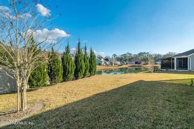 view of yard with a water view