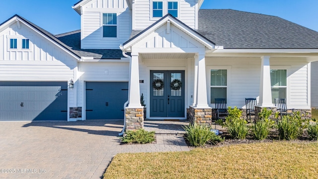 view of front of house featuring a garage and covered porch