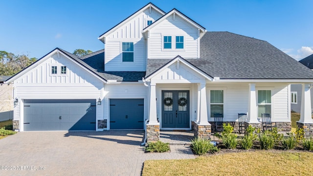 view of front of property featuring a garage and covered porch