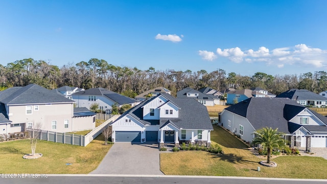 view of front of house with a garage and a front yard