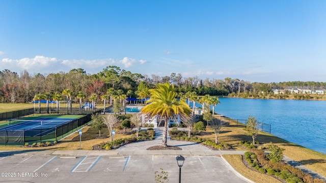 birds eye view of property with a water view