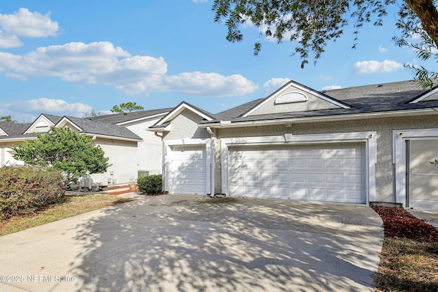 single story home featuring a garage