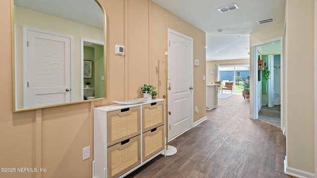 hallway with dark hardwood / wood-style flooring