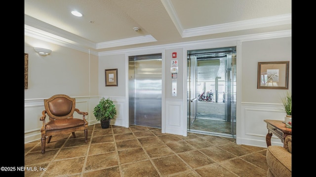 interior space featuring crown molding and elevator